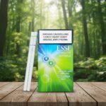 ซองบุหรี่ ESSE Change Double ดีไซน์สีเขียวฟ้าสดใส พร้อมมวนบุหรี่แบบ Super Slim วางบนโต๊ะไม้