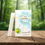 ซองบุหรี่ The One Change สีขาวลายกราฟิกหยดน้ำสีฟ้า วางคู่กับมวนบุหรี่ก้นกรองสีขาวบนโต๊ะไม้ฉากหลังป่า