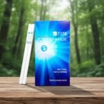 ซองบุหรี่ ESSE Change 4mg สีฟ้าลายรัศมีแสงสว่าง วางคู่กับมวนบุหรี่ Superslims บนโต๊ะไม้ฉากหลังป่า