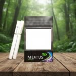 ซองบุหรี่ Mevius Option สีดำพรีเมียมพร้อมลายกราฟิกสีม่วงและเขียว วางบนโต๊ะไม้ฉากหลังป่า