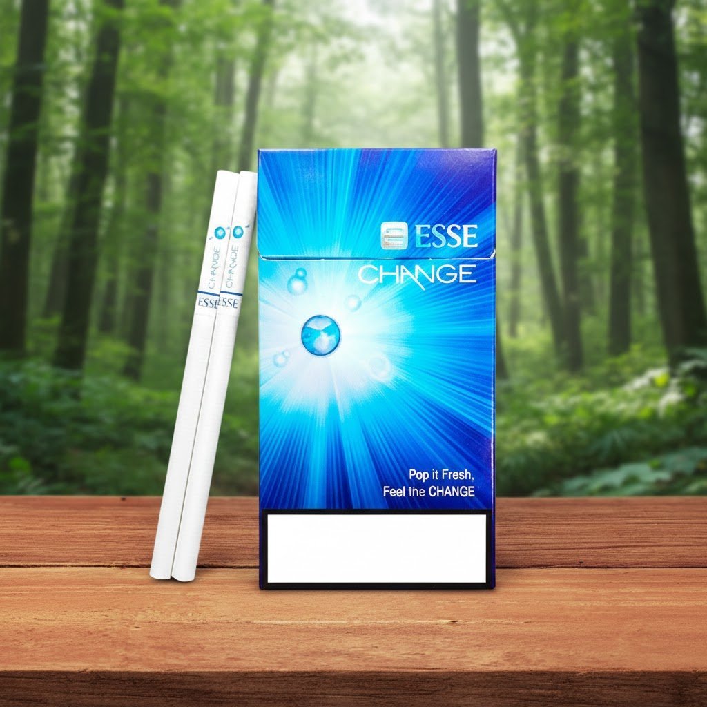บุหรี่ ESSE Change 4mg ซองสีฟ้าดีไซน์ทันสมัยแบบเม็ดบีบ วางบนโต๊ะไม้ฉากหลังป่าไม้ธรรมชาติ