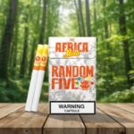 ซองบุหรี่ THIS Africa Mola Random Five สีขาวลายกราฟิกรูปช้างและไอคอนผลไม้หลากสี วางบนโต๊ะไม้ฉากหลังเป็นป่าธรรมชาติ