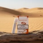 บุหรี่ Mevius Caster LSS ของแท้จากญี่ปุ่น กลิ่นวานิลลา วางบนขอนไม้ท่ามกลางเนินทรายสีทอง