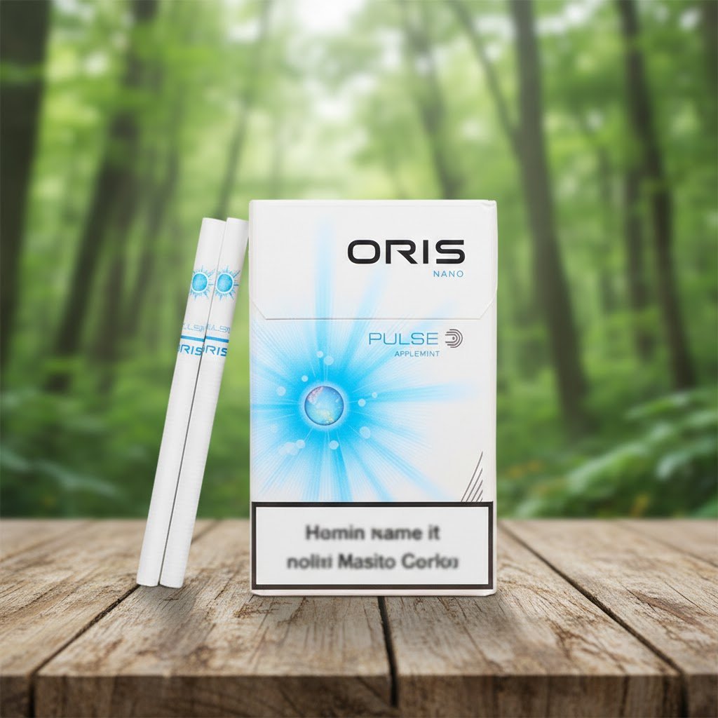 ซองบุหรี่ Oris Nano Pulse Apple Mint สีขาวสะอาดตา ลายพัลซ์สีฟ้า วางบนโต๊ะไม้ท่ามกลางบรรยากาศป่าไม้เขียวขจี