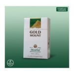ซองบุหรี่ Gold Mount Green แบบซองแข็ง วางบนพื้นหลังสีเขียวไล่เฉด พร้อมข้อความ Experience Coolness และ New Refreshing Flavor