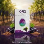 ซองบุหรี่ Oris Grape กลิ่นองุ่น วางคู่กับพวงองุ่นสีม่วงสดและใบเขียว ในบรรยากาศไร่องุ่นตอนพระอาทิตย์ตก