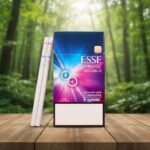 บุหรี่ ESSE Change Double Wine ซองสีน้ำเงินชมพูพรีเมียม พร้อมมวนบุหรี่วางบนโต๊ะไม้กลางป่า